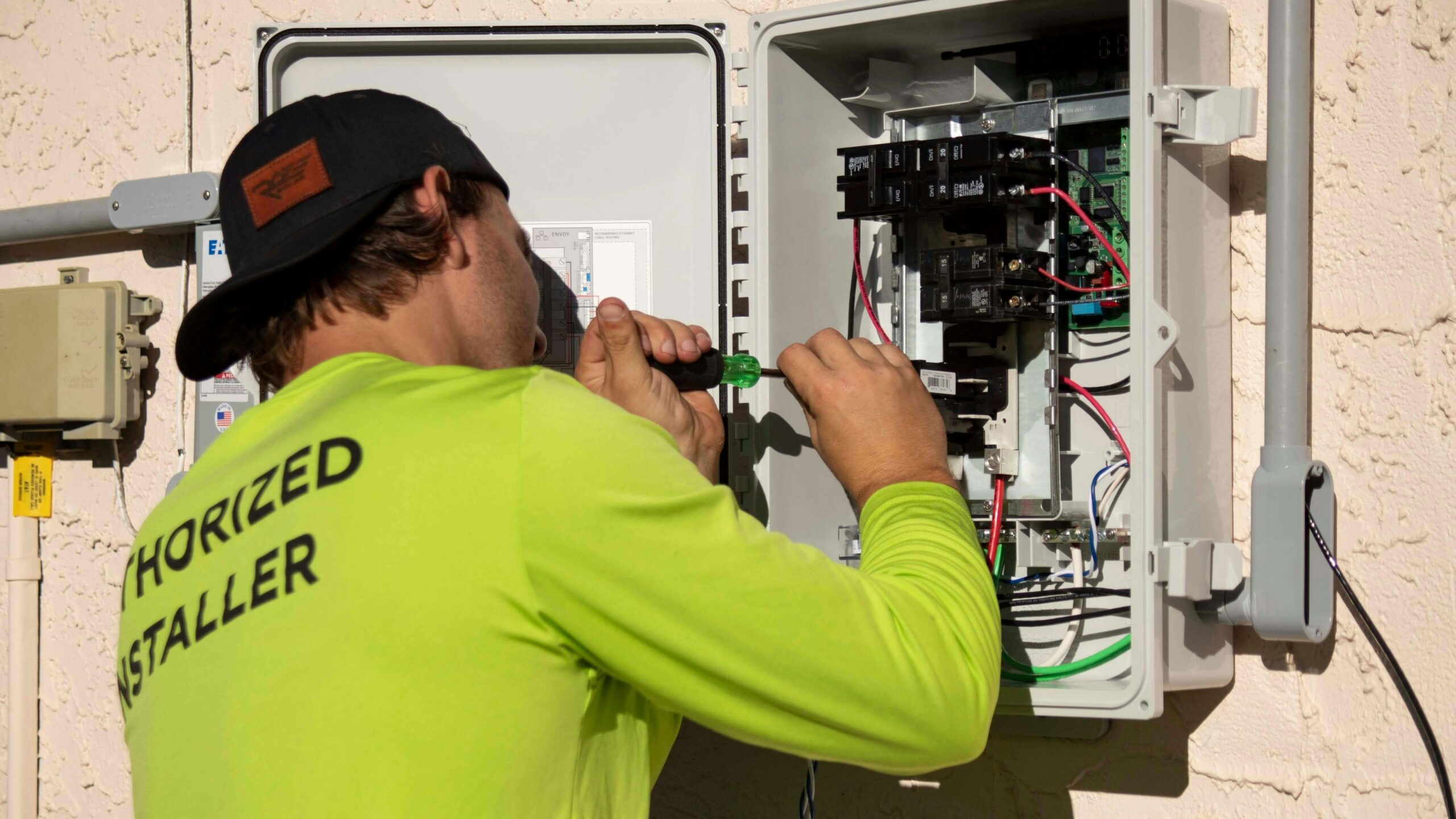 Electrician repairing electrical wiring and switches in a Dubai apartment
